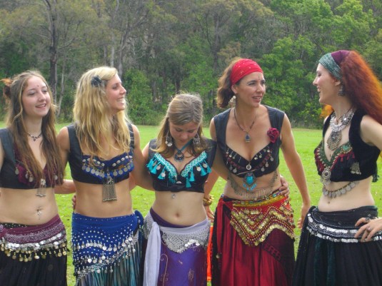 tribal students share a laugh after a belly dance performance